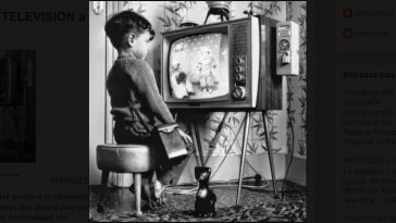 A child watching black and white cartoons.