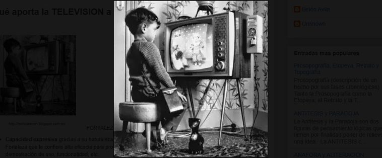 A child watching black and white cartoons.