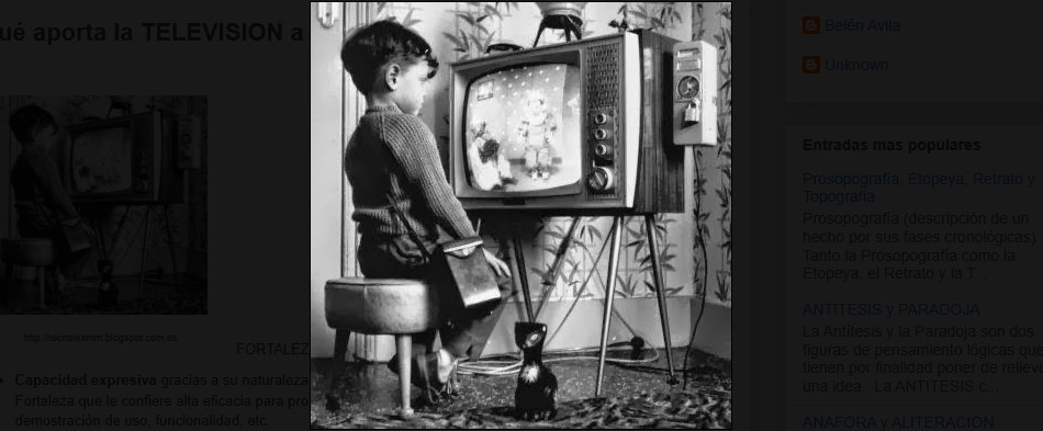 A child watching black and white cartoons.