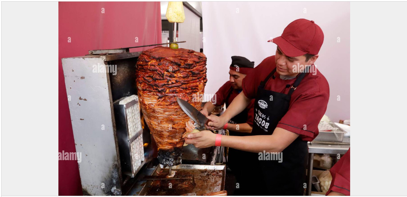 Taquero by Alarmy. A man preparing an Al Pastor taco.